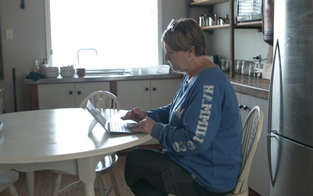 Pauanui's Jodie Hurst has had to do her job remotely with the road out.