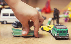 A child plays with toys at a kindergarten or early childcare centre.