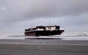 A Westland Mineral Sands motorised barge, the Manahau, came ashore at Carters Beach near Westport during a thunderstorm, between Saturday 31 August and Sunday 1 September, 2024.