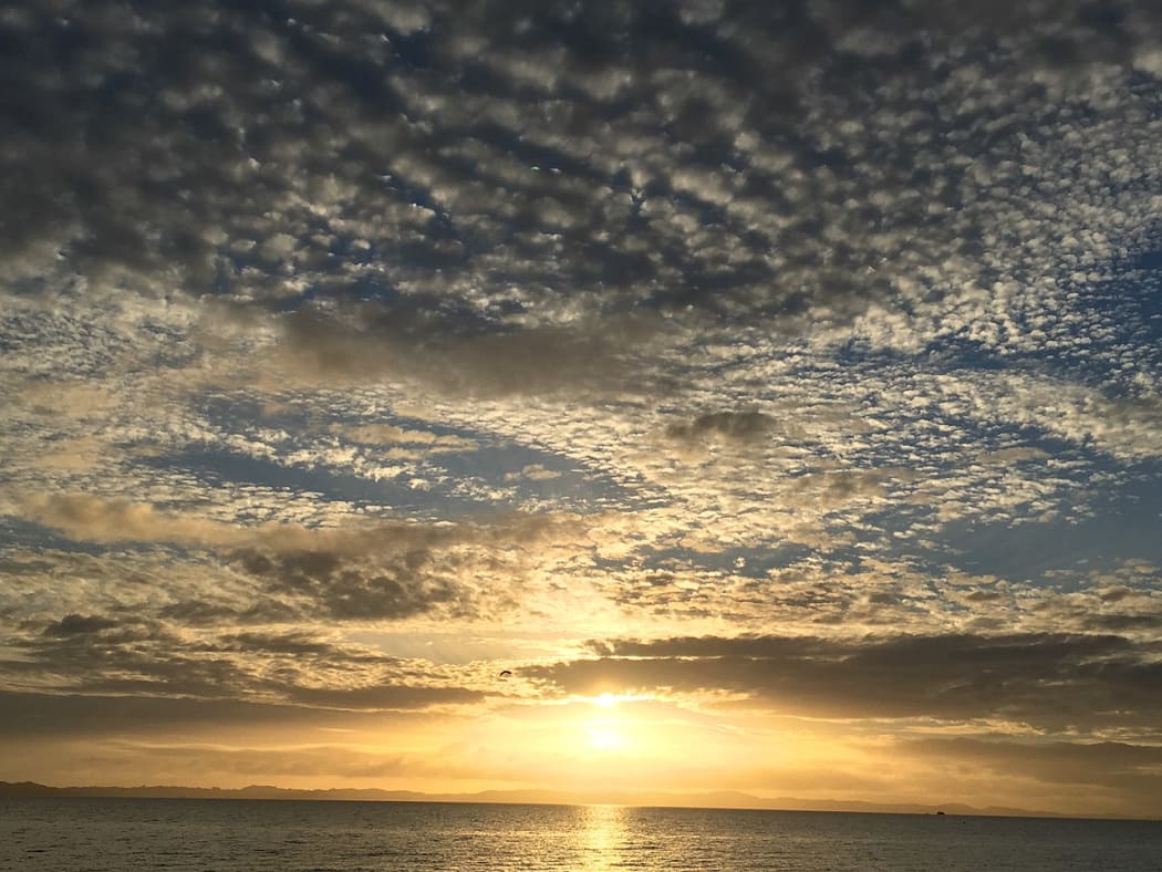 Cloudy sunrise on Eastern Beach, Auckland New Zealand
