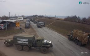 A roadside CCTV footage captured the moment of Russian military vehicles moving in Ukraine's Kherson Region on Friday February 25, 2020 morning.