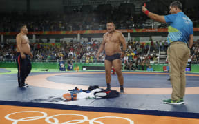 Mongolian wrestling coaches strip ff in protest of 65kg bronze medal match outcome