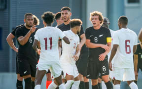 Players of both teams (L-R: Bill Tuiloma, Michael Boxall and Joe Bell of New Zealand) argue during the New Zealand All Whites v Qatar friendly in Austria.