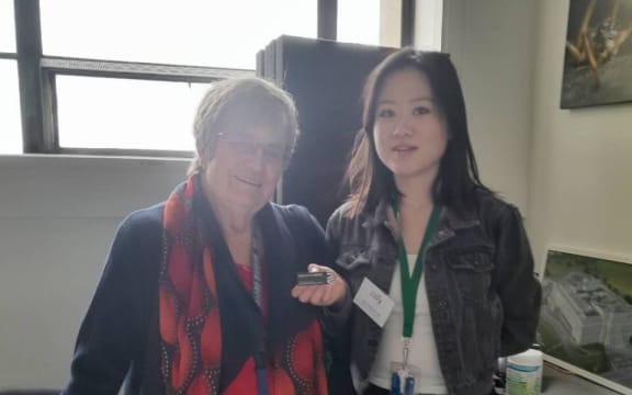 A picture of two people standing for a photo.