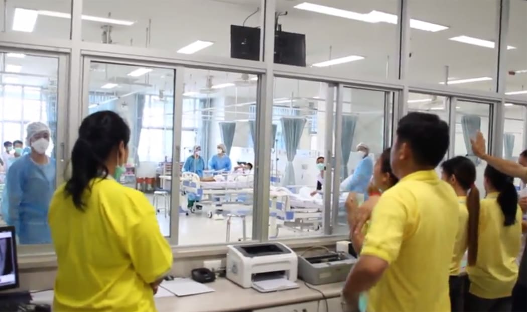 Image released on 11 July shows the rescued boys treated at a hospital in Chiang Rai.