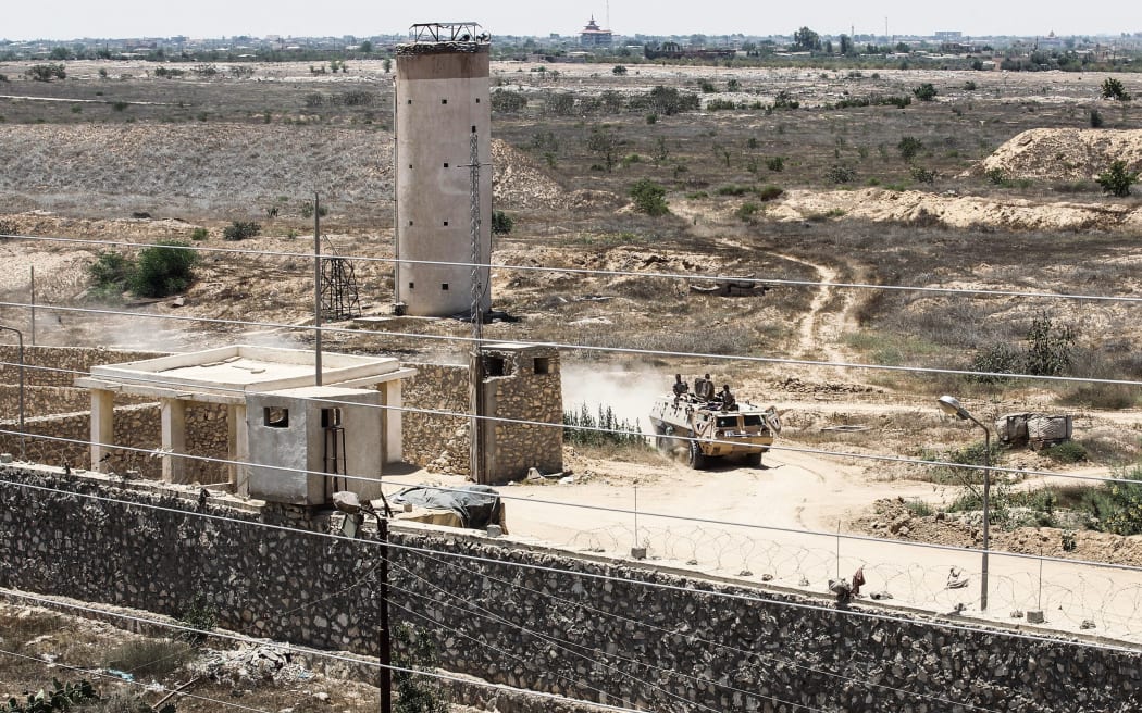 Egyptian guards patrol the border with Gaza at military checkpoints. This photo was taken from the Gaza strip border town of Rafah.