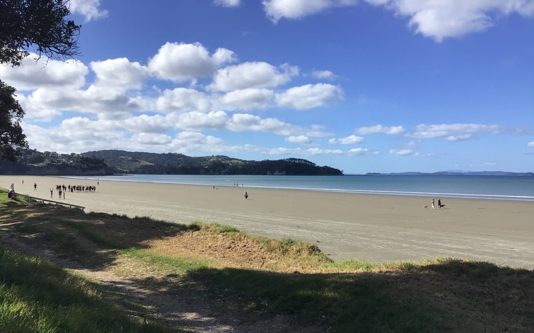 Audrey listens to RNZ Concert from Orewa Beach