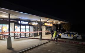 Police said an attacker went into several businesses on Corinthian Drive in Albany at about 9pm on 19 June and hit customers with a weapon.