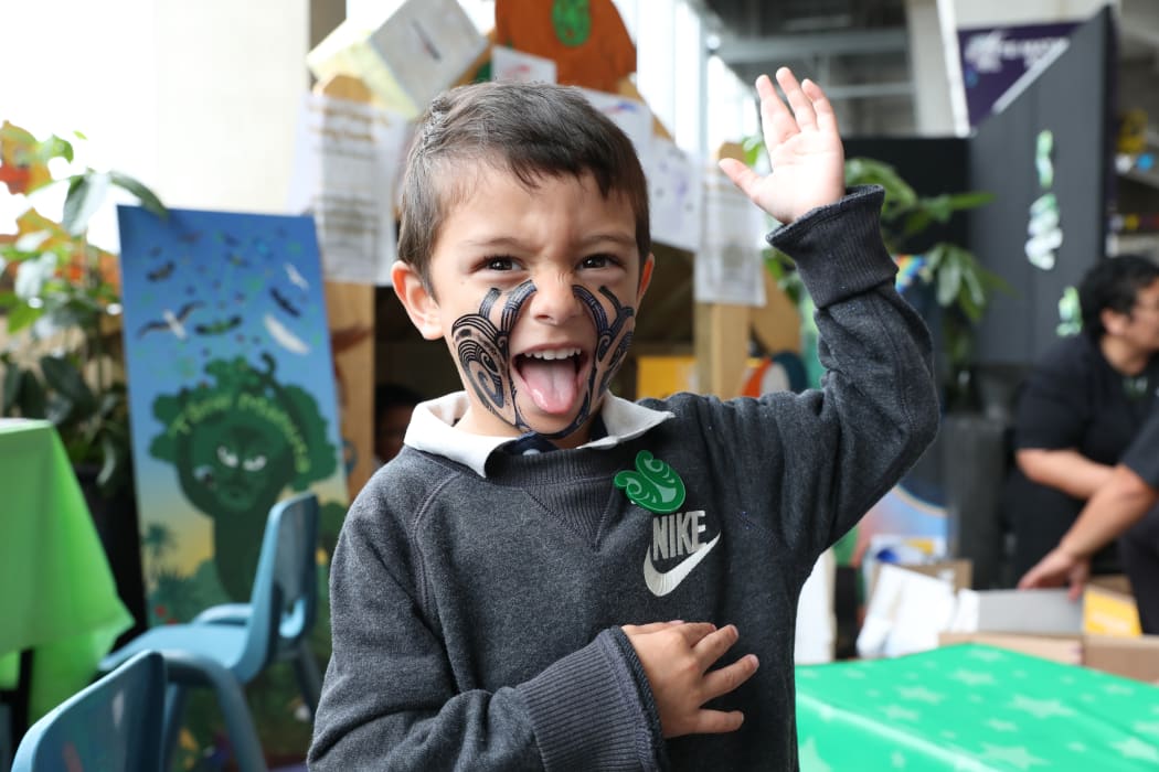 In the concourse of Westpac stadium hundreds of stalls were set up, some painting tā moko on children's faces.