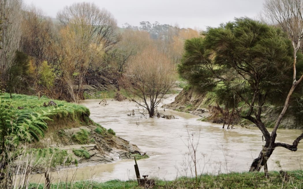 The Pakarae River, where State Highway 35 crosses it. Previous scouring of banks shows where the water level was during Gabrielle.
