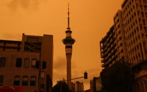 Auckland's Sky Tower in the foreground of a hazy sky from Australia's bushfires.