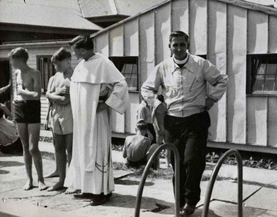 Rector Fred Durning, right, next to Father Michael Shirres, who  was recently exposed as a pedophile, with St Patrick’s College (Upper Hutt) students at a sports event in 1955.