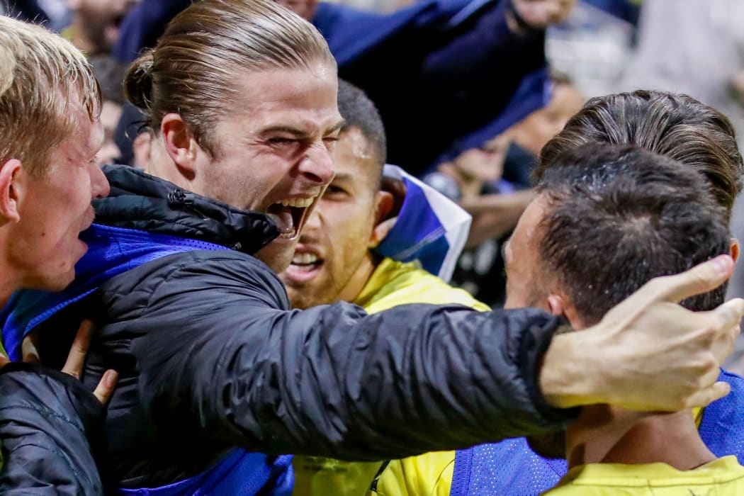 Alex Rufer celebrates Tomer Hemed's winning goal against Adelaide United