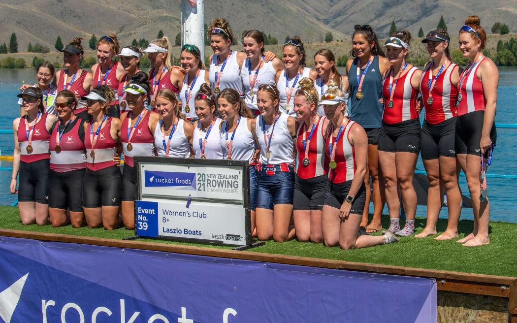 Womens club eight podium Canterbury 1st (center) Avon 2nd (right) and Wellington 3rd (Left) 


Nina Jarman (stroke), Aimee Giles, Orla Fitzgerald, Anna Clinch, Katie Gardener, Piper Spencer, Millie White, Sophie Chapman + Skye Duncan (cox)

Wellington
Verity Taylor (stroke), Stephanie McDermott, Elizabeth Rine, Alison Faulls, Cosmiana Brown, Eleanor Chichester, Abigail Watts, Ange Rogers + Ella Greenslade (cox)

Avon
Tyler Stewart (stroke), Claudia Kinder, Greta Hawke, Sophie Radcliffe, Sarah Pahlen, Emily Lattimore, Lucy Mayne, Grace Hogan + Timothy Heritage (cox)


Finals day at the 2021 Rocket Foods New Zealand National Club Championships, on Lake Ruataniwha, Twizel, New Zealand. Saturday  20 February 2021.  Copyright photo © Steve McArthur / www.photosport.nz