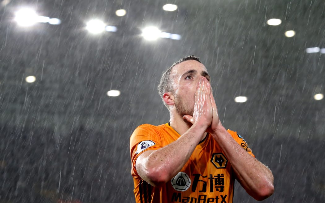 Diogo Jota reacts after missing a chance when playing for Wolves.
