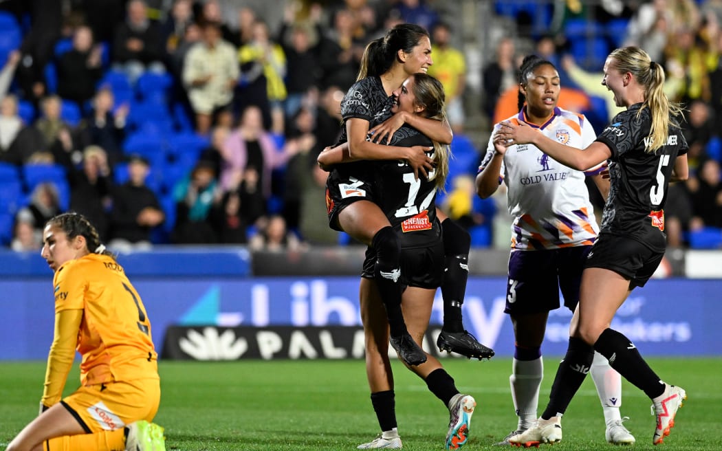 Chloe Knott celebrates scoring the winning goal against the Perth Glory .