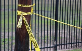 Caution tape surrounds the property where a mass shooting took place in Cleveland, Texas on 29 April, 2023.