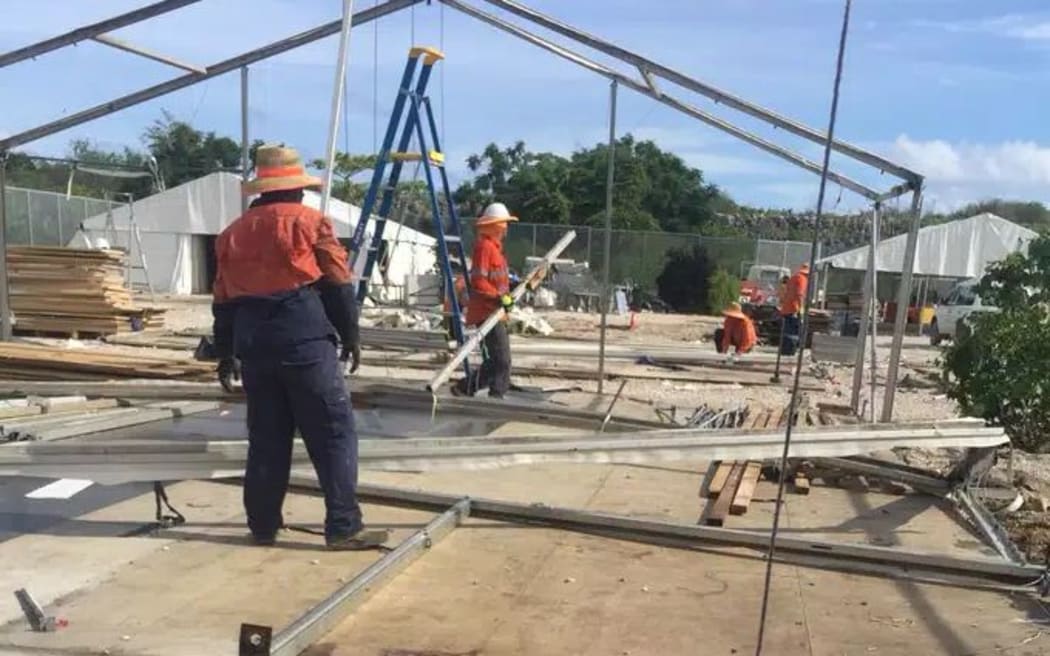 Workers demolishing a tent in RPC3.