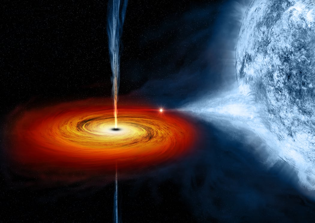 An artist's drawing of a black hole named Cygnus X-1. It formed when a large star caved in. This black hole pulls matter from the blue star beside it.