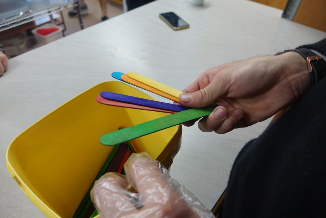 On The House has started a lottery system using coloured iceblock sticks to manage people queuing to get into its pop-up stores.
