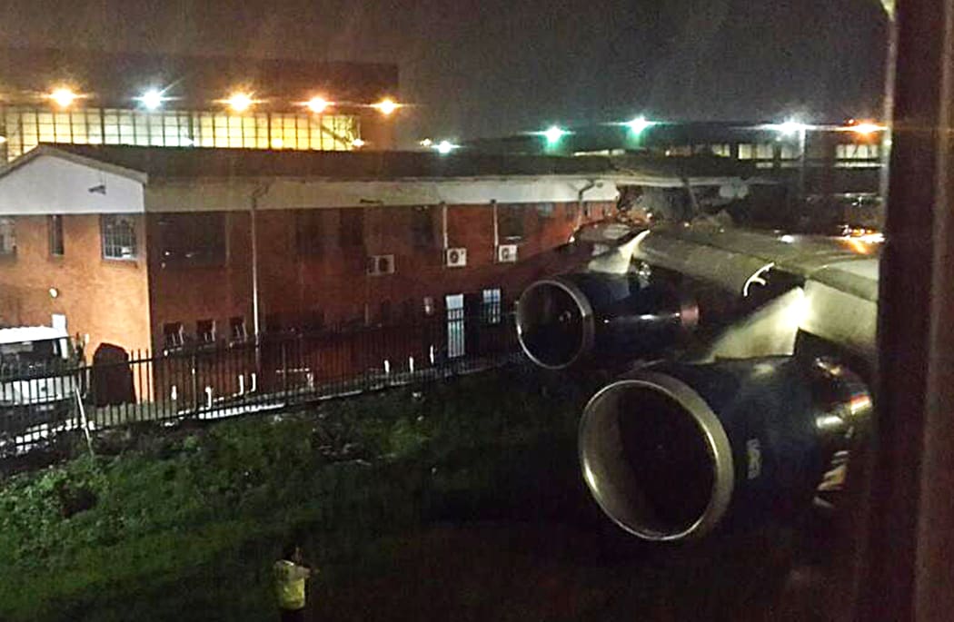 The wing of the British Airways plane hit an office building.