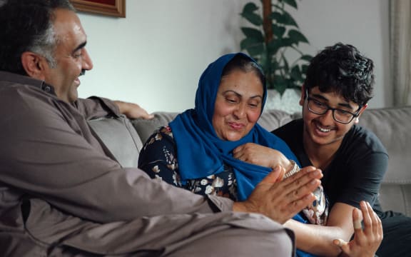 (L-R) Habib, Tooba, and Usman on the couch