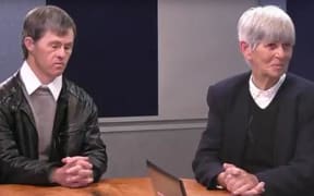 Margaret Spencer and her son Paul speak to John Campbell.