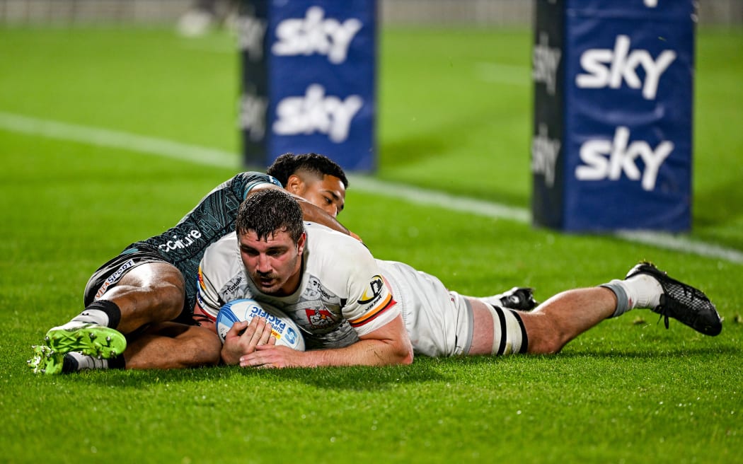 Simon Parker of the Chiefs scores a try against Moana Pasifika  at Go Media Stadium in Auckland.