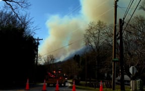 Image depicts two wildfires burning in Buncombe County, North Carolina, on Saturday 1 March, 2025.