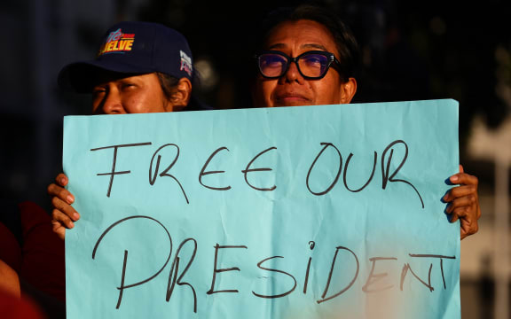 A woman holds a sign that reads, 'Free our president', during a march in support of Venezuelan President Nicolas Maduro and his wife Cilia Flores, both detained in the United States, in Caracas, Venezuela, on January 4, 2025.