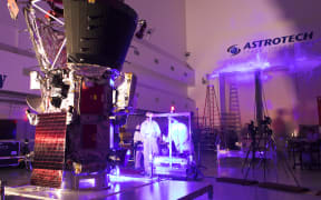 In the Astrotech processing facility in Titusville, Florida, near NASA's Kennedy Space Center, on Tuesday, June 5, 2018, technicians and engineers perform light bar testing on NASA's Parker Solar Probe. The Parker Solar Probe will launch on a United Launch Alliance Delta IV Heavy rocket from Space Launch Complex 37 at Cape Canaveral Air Force Station in Florida no earlier than Aug. 4, 2018. The mission will perform the closest-ever observations of a star when it travels through the Sun's atmosphere, called the corona. The probe will rely on measurements and imaging to revolutionize our understanding of the corona and the Sun-Earth connection.
