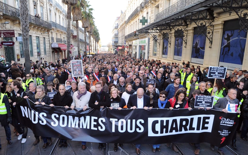 Marchers in Montpellier hold a banner reading "Nous sommes tous Charlie" (We are all Charlie).