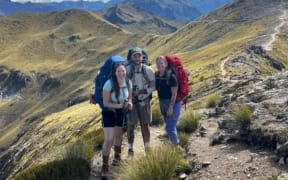 Canadian hikers Annie-Pier Bourgeois (left), Antoine Beauchamp and Chanel Sabourin-Dubois spotted what they believe is a moose at the end of the Kepler Track, a day after this photograph was taken.