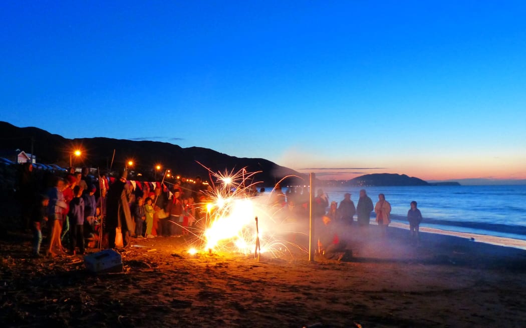 Paekākāriki community gather at the beach.