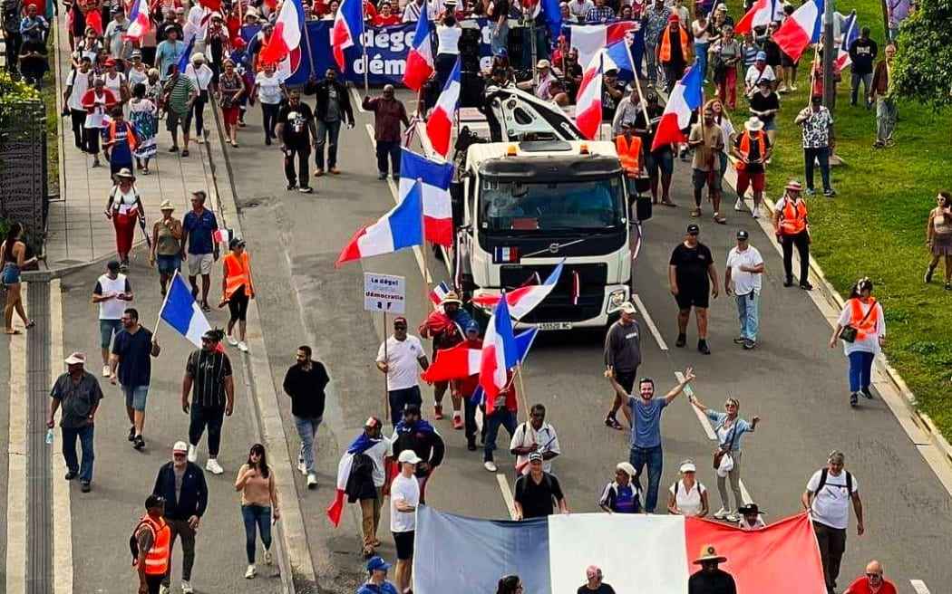 An estimated 20,000 wave of anti-independence supporters with French flags gathered on Nouméa's Baie de la Moselle on Saturday 13 April 2024.