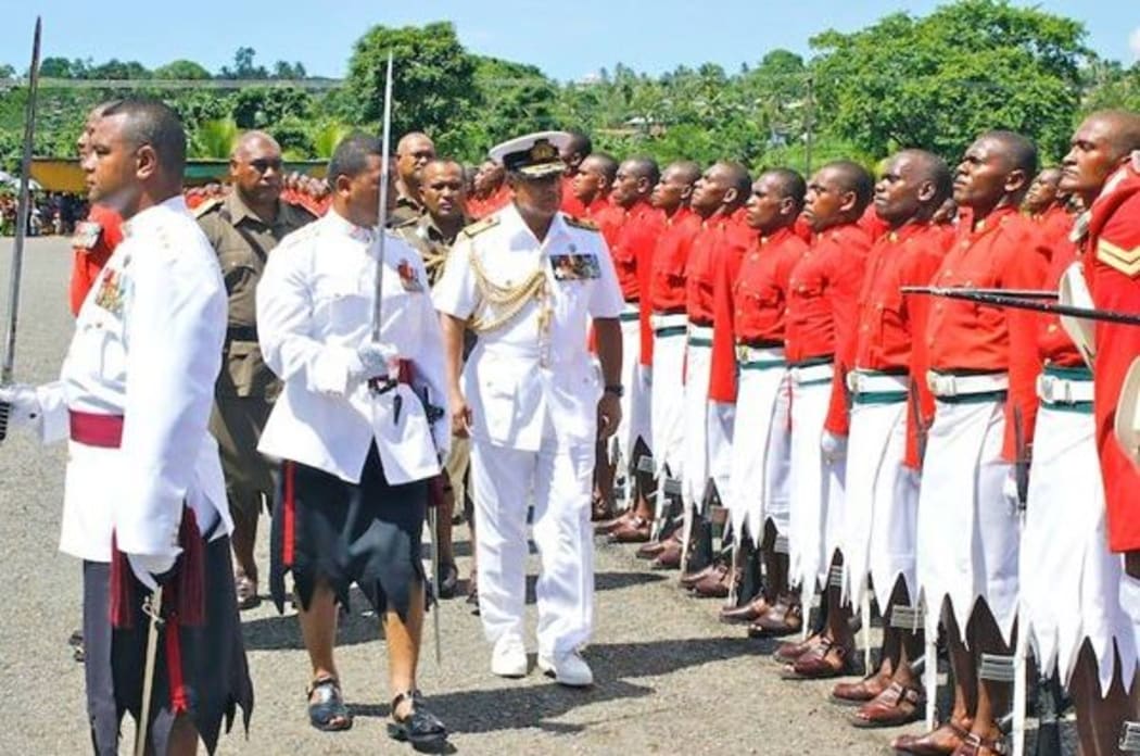 Fiji PM Frank Bainmarama inspects a military pass out parade.