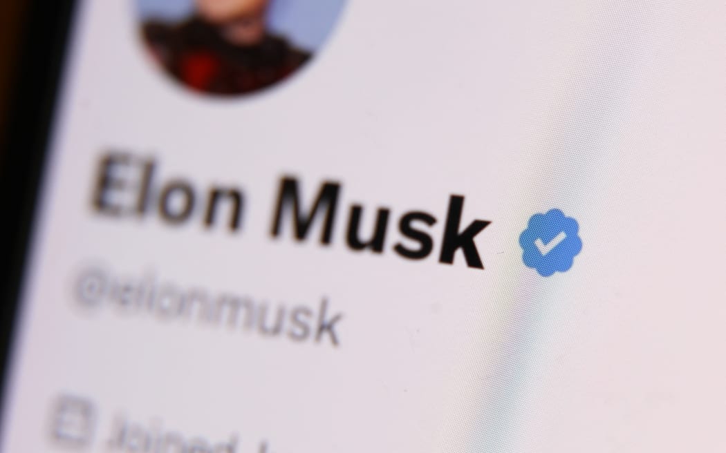 The blue checkmark on Elon Musk account on Twitter is seen displayed on a phone screen.