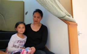 polly and her daughter sit on the stairs