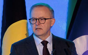 Australia Prime Minister Anthony Albanese speaks at the Sydney Energy Forum on July 12, 2022, in Sydney. - The Sydney Energy Forum brings together global leaders across government, industry, academia, technology and innovation to identify solutions to delivering clean energy supply chains across the Indo-Pacific. (Photo by Brook MITCHELL / POOL / AFP)
