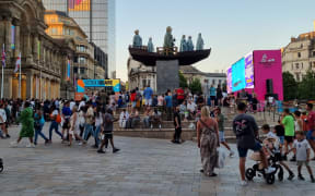 People watching the big screen of the closing ceremony at Victoria square in Birmingham.