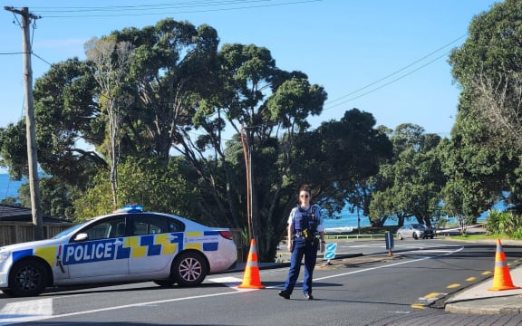 Police officer at Murrays Bay on North Shore