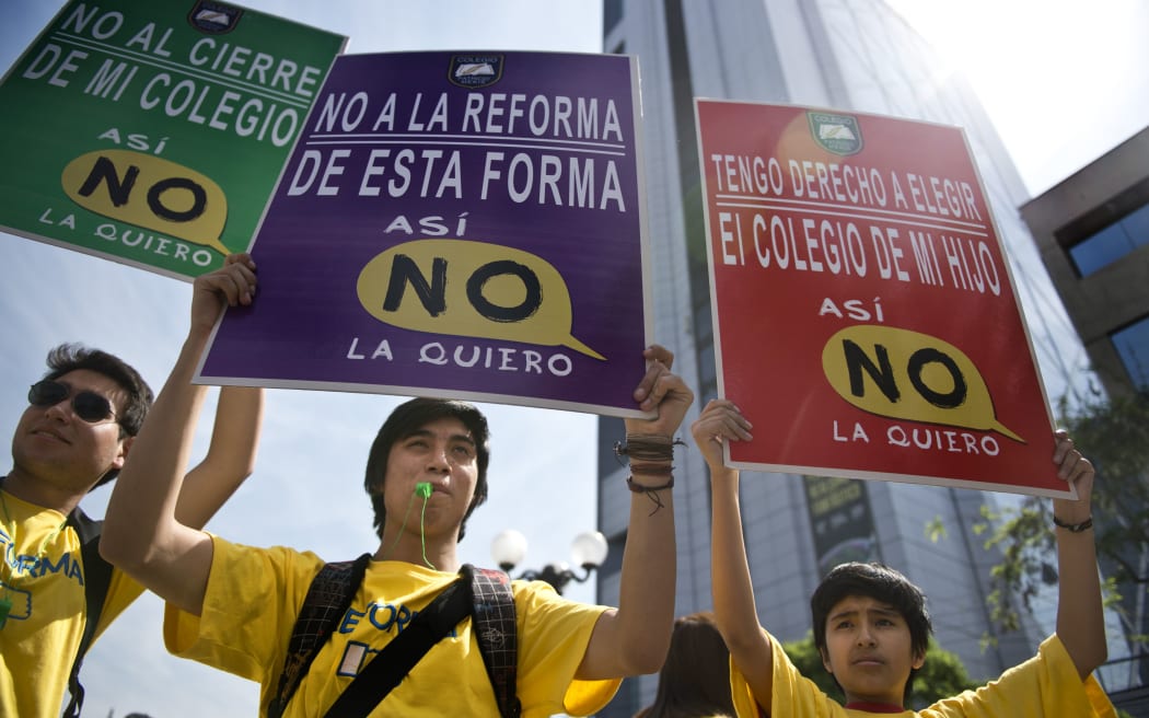 Thousands of Chilean students and parents protest the country's new education system in Santiago.