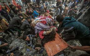 12/07/2023 Gaza, Palestine. Palestinian residents are actively involved in search and rescue efforts following the Israeli airstrikes on December 7, 2023, in Khan Yunis, Gaza. The increased military activities by Israel in southern Gaza have prompted these local rescue operations. During their efforts, they uncovered six injured individuals and discovered the lifeless bodies of fifteen victims in the aftermath of the airstrikes. (Photo by Mohammed Zaanoun / Middle East images / Middle East Images via AFP)