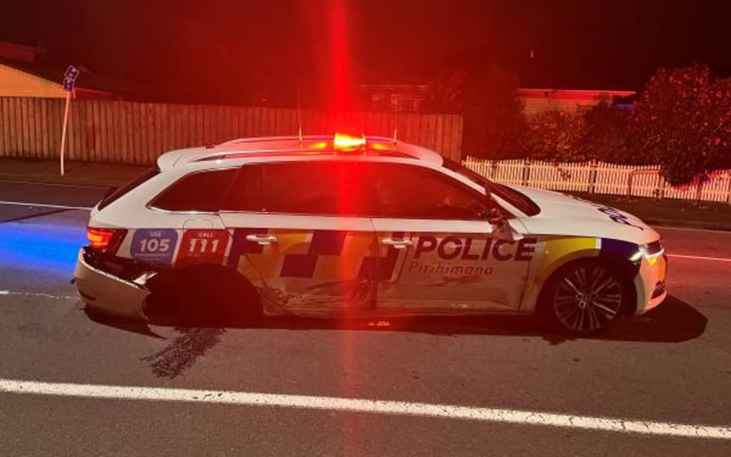 Police car damaged in crash involving suspected drunk driver.