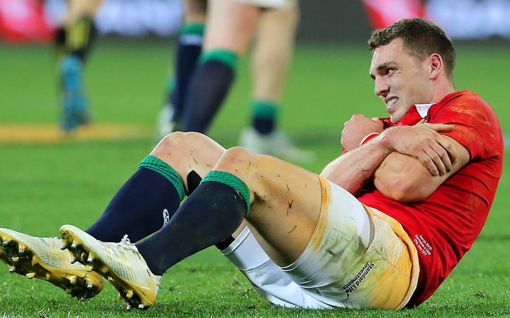 Lions' George North injures his shoulder during their clash with the Hurricanes.