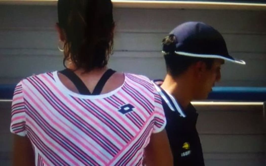 Alize Cornet with her shirt on back to front.