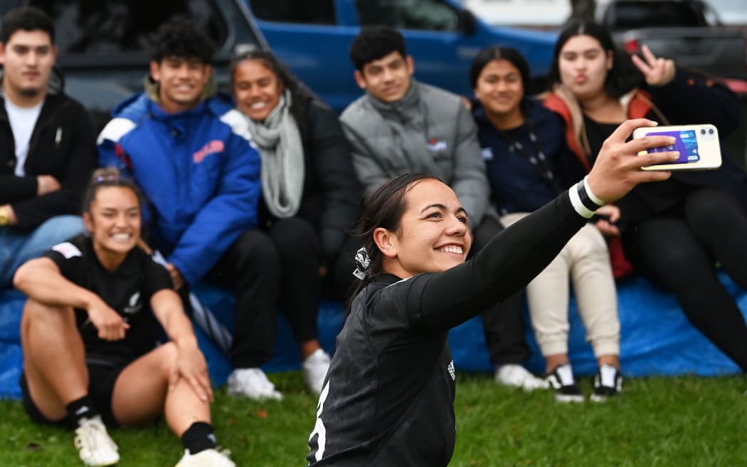 Stacey Fluhler takes a selfie of family and friends.