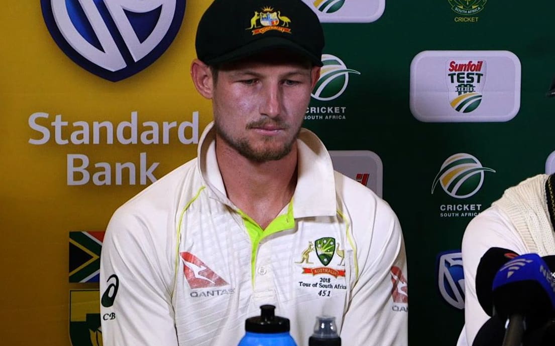 Australia's captain Steve Smith (R), flanked by teammate Cameron Bancroft, speaking as he admitted to ball-tampering during the third Test against South Africa.