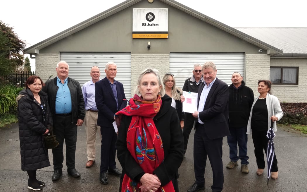 Jo Tucker, centre, with other South Hokianga residents and Northland MP Grant McCallum at Friday's petition handover.