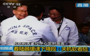 Scientists at the control centre celebrate the mission's "most difficult task".